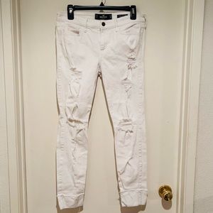Hollister white ripped jeans with cuffed legs.